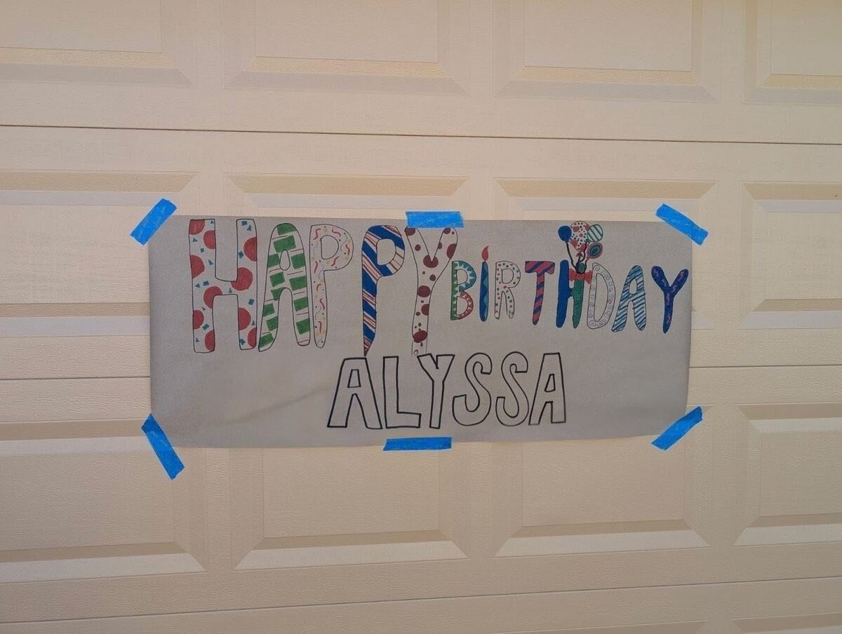 A photo of a giant sign that says 'Happy Birthday Alyssa' on it.
